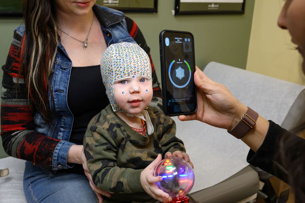 Certified Orthotist fitting a cranial remolding helmet
