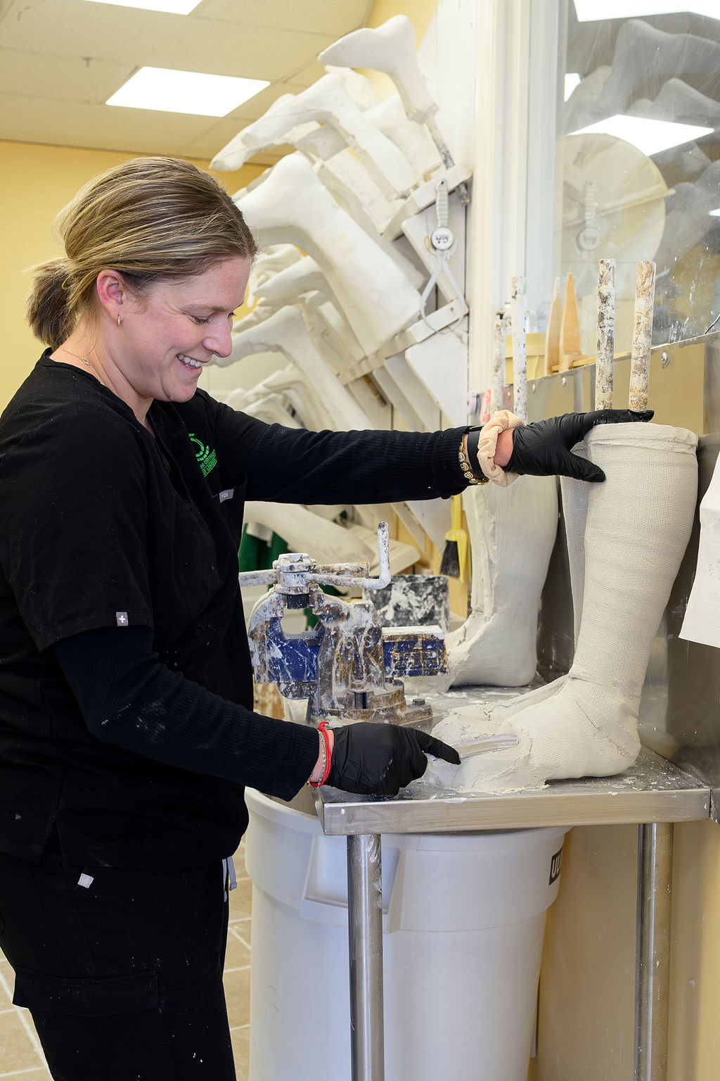 Certified Orthotist modifying an orthosis