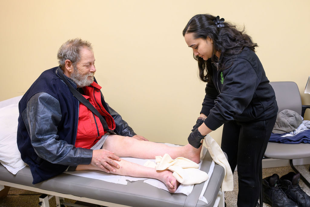 Certified Orthotist measuring a client’s leg