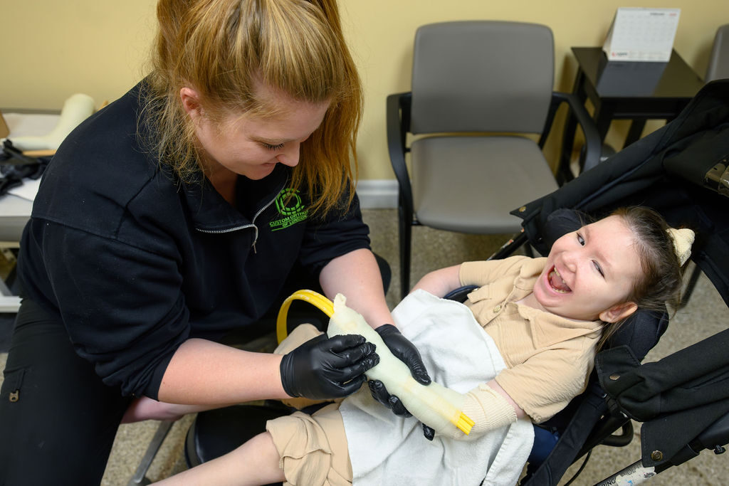 Certified Orthotist casting a child’s arm