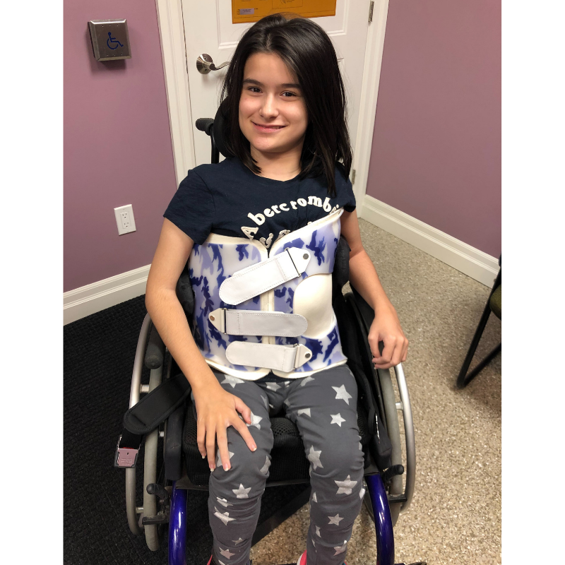 Child wearing a custom TLSO